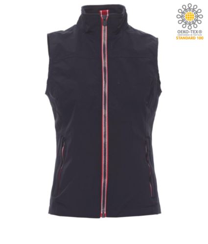 Gilet da donna, zip da 8mm a contrasto, due tasche esterne con zip coperta. Interno: non imbottito, retinato, una tasca con cerniera e predisposizione per cuffie e cavo smartphone zip al petto e sul fondo per agevolare stampe e ricami. Colore Blu Navy